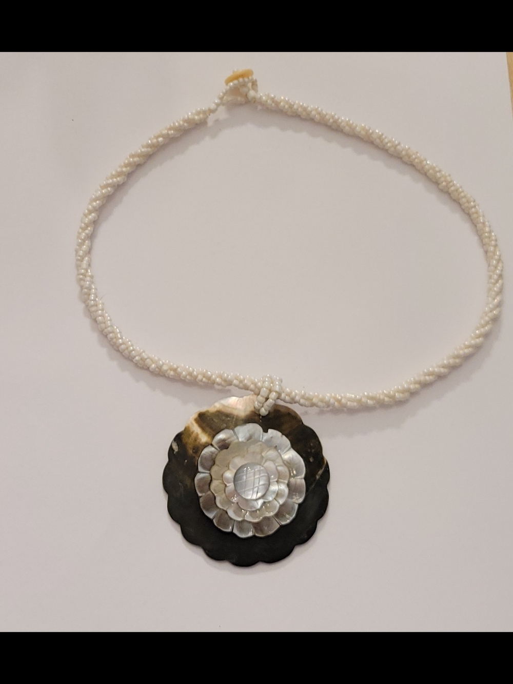 Handcrafted White Beaded Necklace with Mother-of-Pearl Floral Pendant